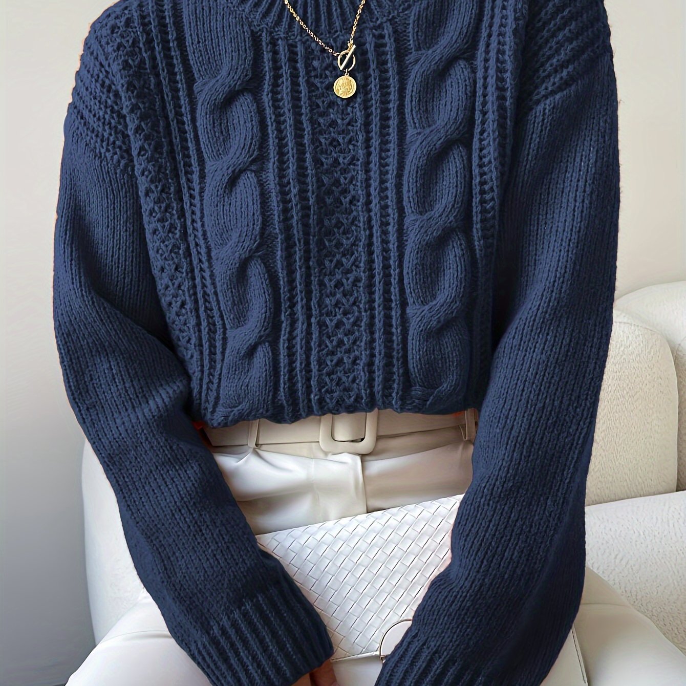 Suéter trançado de tricô