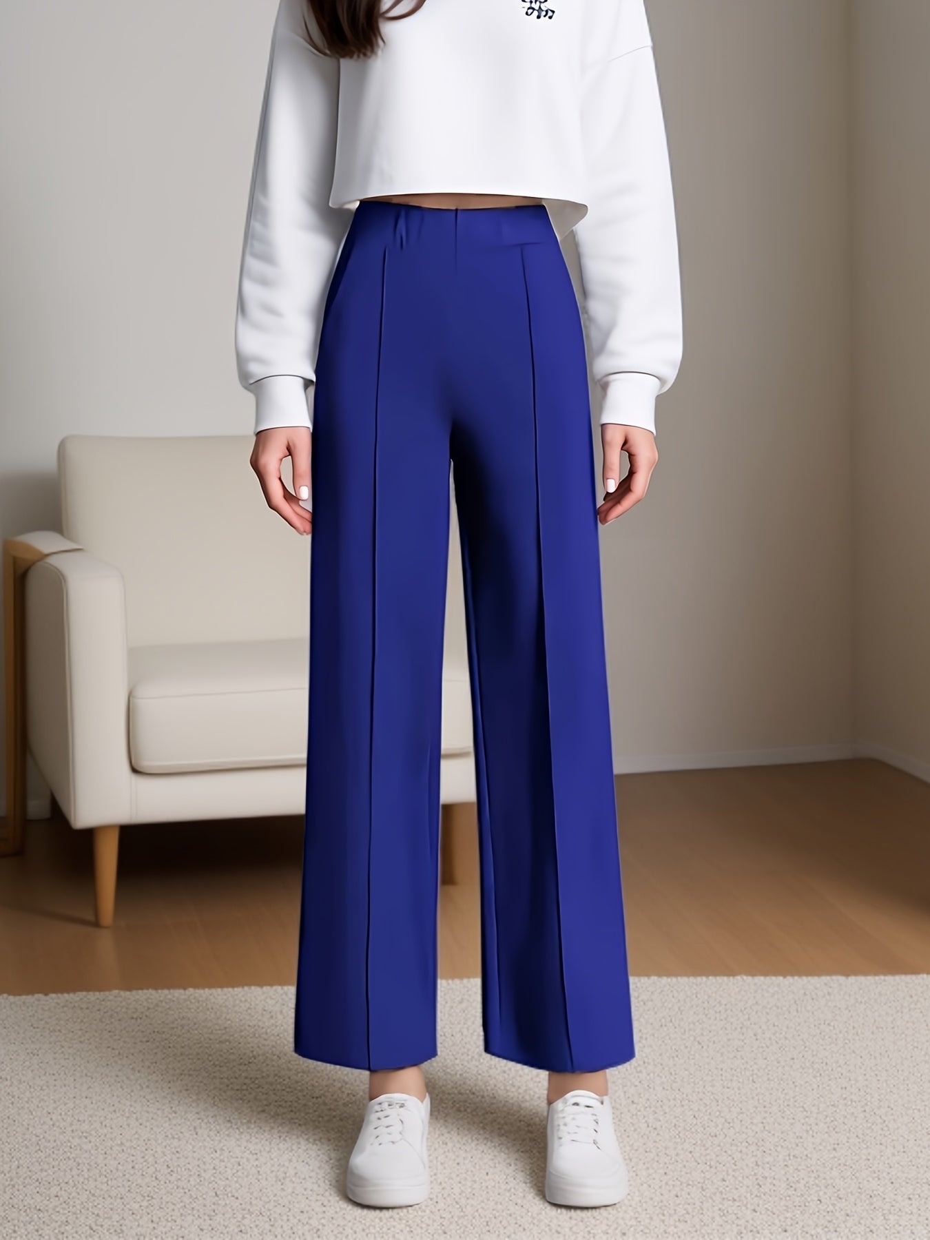 Calça com cintura alta e elástica, modelagem reta e com bolsos