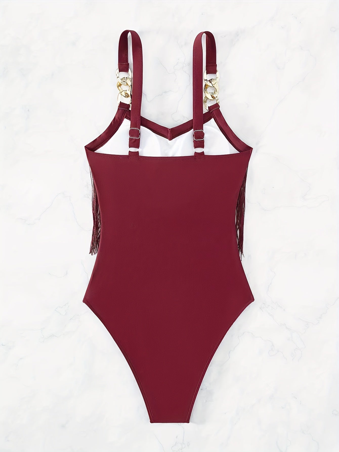 Maiô com detalhes de corrente nas alças, franjas e transparência